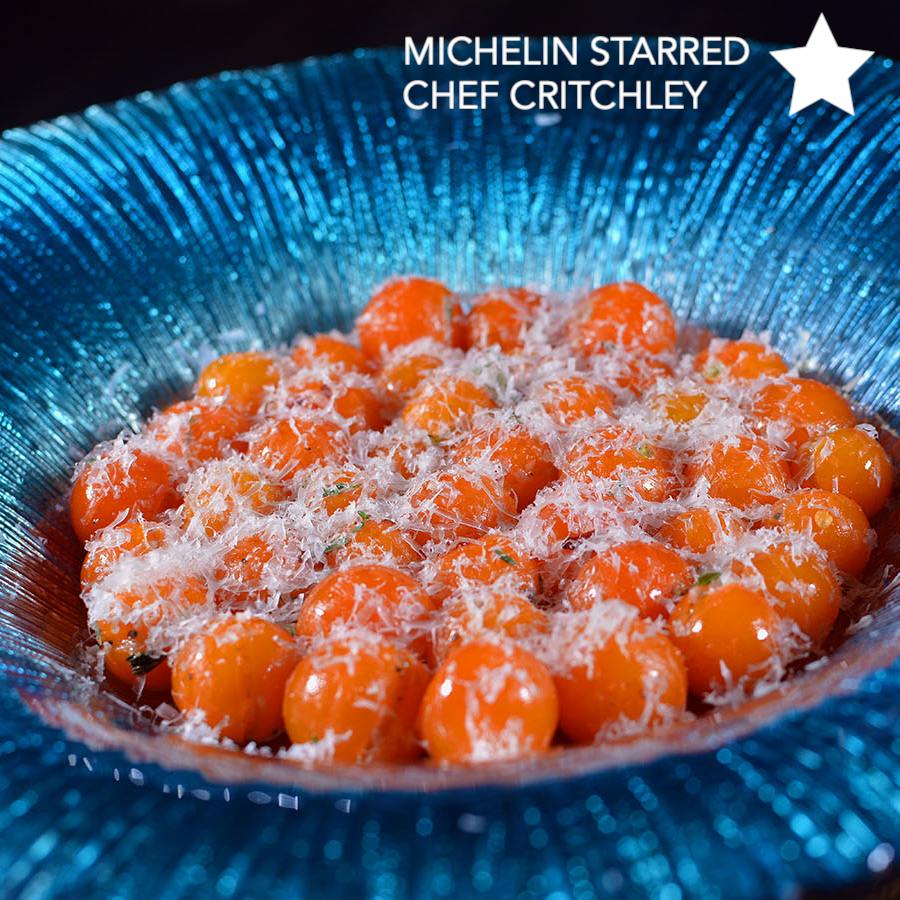 Marinated Sun gold tomatoes with aged sheep's cheese on indoor grill Cinder grill precision cooker