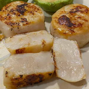 Beautifully seared scallops from the Cinder Grill.  Photo credit Adisak Pochanayon